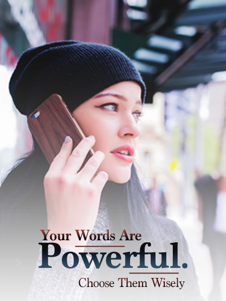 woman with dark hair, wearing beanie and talking on the phone