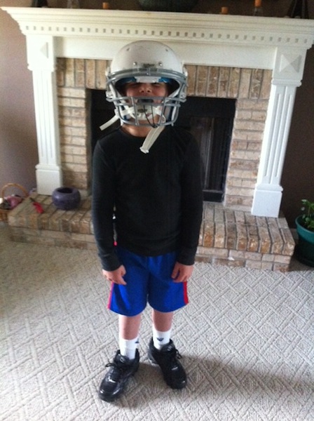 Jayden with football helmet