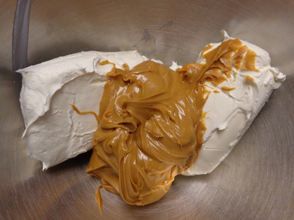 cream cheese and peanut butter in a bowl ready to be mixed together