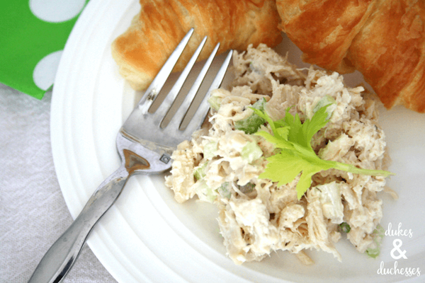 plate of chicken salad with croissant