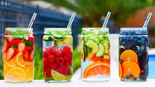 glass jars with fruit infused water