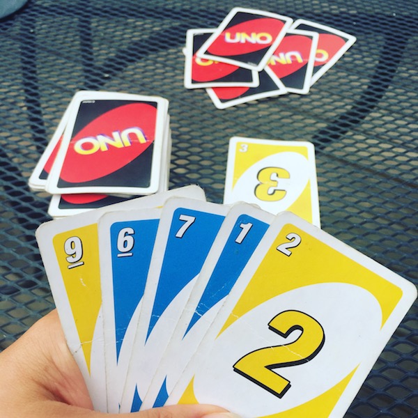 hand holding uno cards