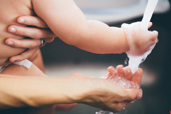 mother and child washing their hands